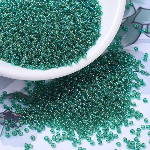 

PandaHall MIYUKI Round Rocailles Beads, Japanese Seed Beads, 11/0, (RR295) Transparent Emerald AB, 2x1.3mm, Hole: 0.8mm, about 1111pcs/10g..., Green