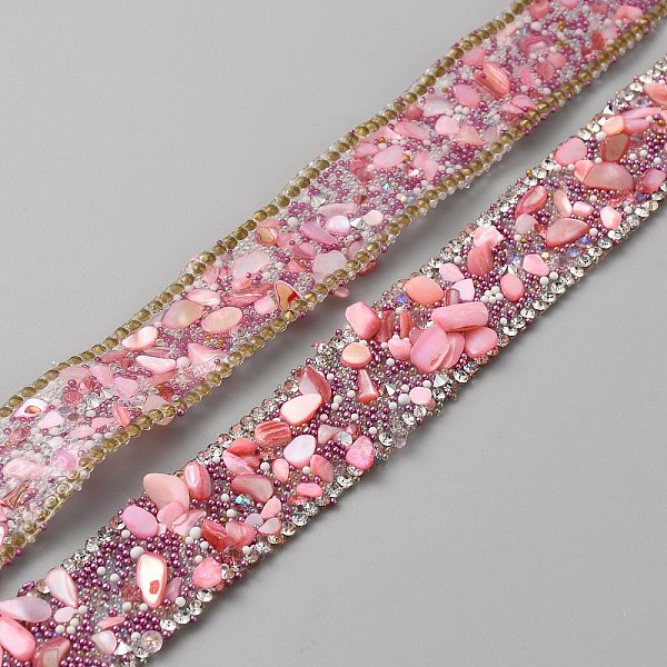 

PandaHall Hotfix Rhinestone Tape, with Stone Chip, for Costume Accessories, Belt Decoration, Pearl Pink, 20x4~5mm, about 50cm/pc Resin...