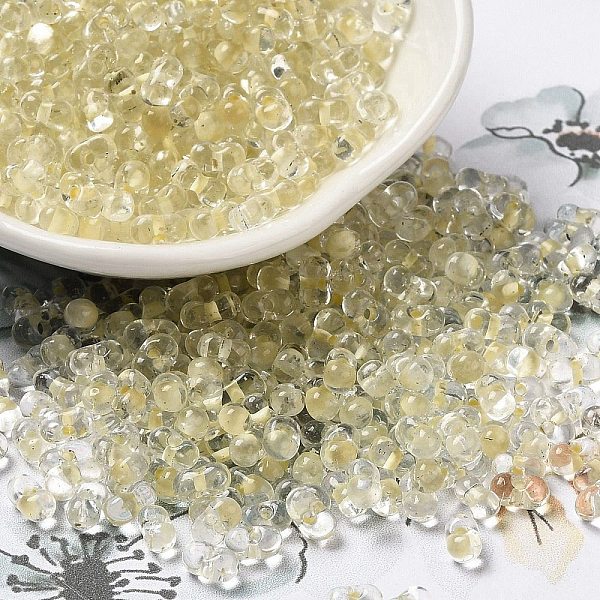 

PandaHall Glass Seed Beads, Peanut, Light Khaki, 5.5~6x3~3.5x3mm, Hole: 1~1.2mm, about 4000pcs/pound Glass Peanut