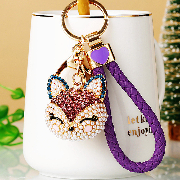 

PandaHall Full Rhinestone Pearl Fox Head Pendant Keychain, with Zinc Alloy Findings and Polyester Cord, for Women's Bag Pendant Decorations..., Purple
