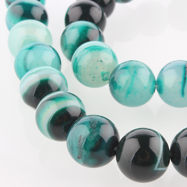 

PandaHall Natural Striped Agate/Banded Agate Round Bead Strands, Dyed, Dark Cyan, 10mm, Hole: 1mm, about 38pcs/strand, 14.96 inch Banded...