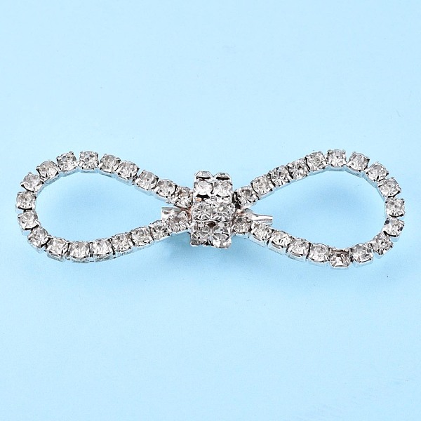 

PandaHall Crystal Rhinestone Bowknot Lapel Pin, Creative Brass Badge for Backpack Clothes, Silver, 22x69.5x12mm, Pin: 0.6mm Brass Clear