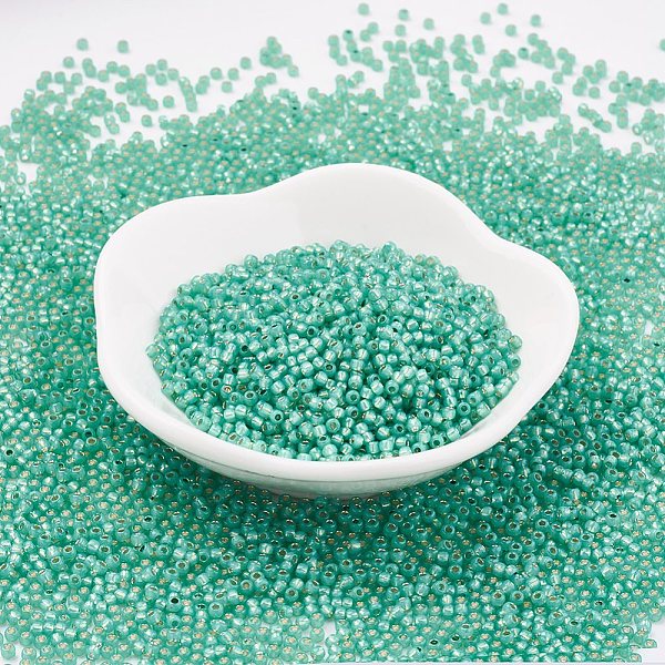 

PandaHall TOHO Japanese Seed Beads, Round, 11/0 , (2119) Silver Lined Dk Mint, 2x1.5mm, Hole: 0.5mm, about 42000pcs/pound Glass Cyan