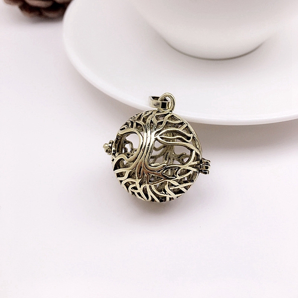 

PandaHall Brass Hollow Round with Tree of Life Cage Pendants, For Chime Ball Pendant Necklaces Making, Antique Bronze, 24x21mm Brass Round