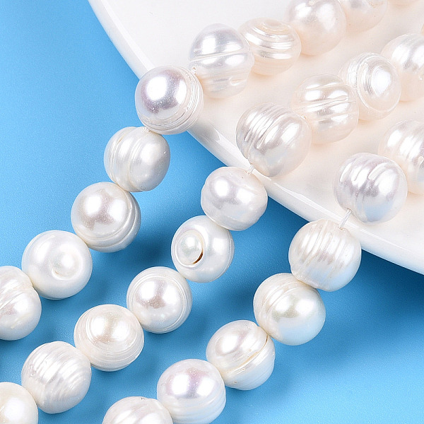 

PandaHall Natural Cultured Freshwater Pearl Beads Strands, Potato, Seashell Color, 10~11x8.5~13.5mm, Hole: 0.7mm, about 18pcs/strand...