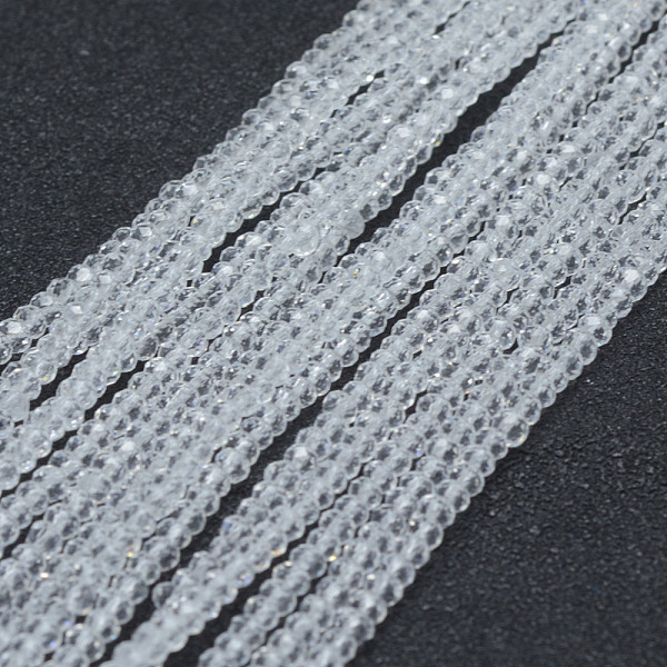 

PandaHall Transparent Glass Beads Strands, Faceted, Rondelle, Clear, 2.5x1.5mm, Hole: 0.5mm, about 197~201pcs/strand, 12.9 inch(33cm) Glass...