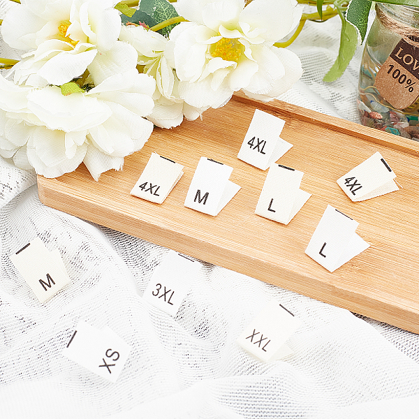 

PandaHall 480 Pcs Woven Clothing Size Labels, XS/S/M/L/XL/XXL/3XL/4XL Cotton Crafting Embroidered Labels Sewing Tags Garment Shirts Dresses..., White