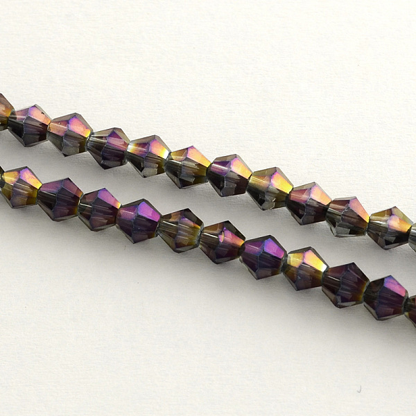 

PandaHall Electroplate Glass Bead Strands, Rainbow Plated, Faceted Bicone, Purple, 4x4.5mm, Hole: 1mm, about 82~85pcs/strand, 30.5~31cm...