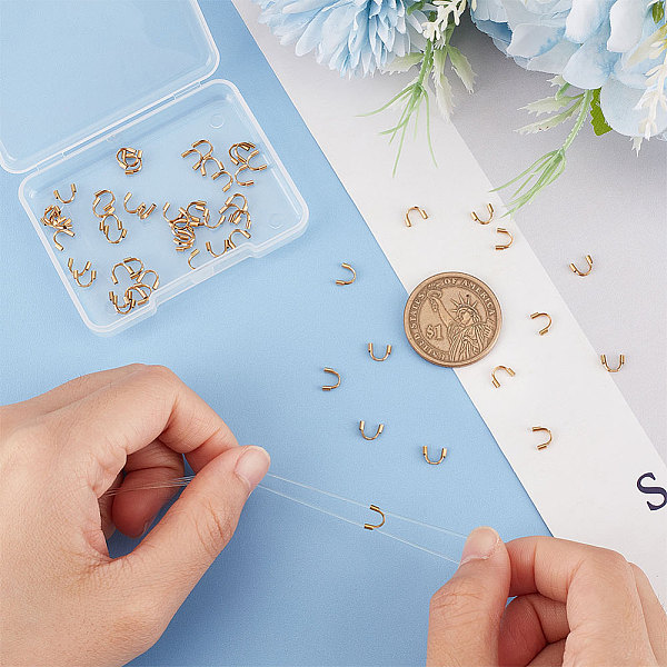 

PandaHall UNICRAFTALE 60pcs Hole 0.7mm Golden 316 Surgical Stainless Steel Wire Guardian U Shape Loops Metal Wire and Thread Protector Loops...